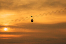 The Cable Car Behind The Sunset Is Moving.