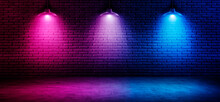 Black Brick Wall  Background With Neon Lighting Effect Pink Purple And Blue. Glowing Lights On Empty Brick Wall Background