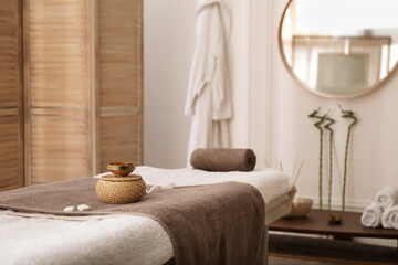 Sticker - Stylish room interior with massage table in spa salon