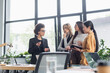 © LIGHTFIELD STUDIOS - african american businesswoman gesturing while talking to multiethnic managers in office