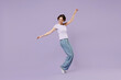 © ViDi Studio - Full length side view young smiling excited cheerful happy woman 20s with bob haircut in white t-shirt leaning back stand on toes dancing have fun isolated on pastel purple background studio portrait.