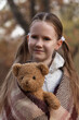 © Olga - girl with teddy bear