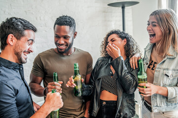 Wall Mural - Friends having fun while drinking beer together.