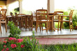 flowers and table and chairs outside the restaurant