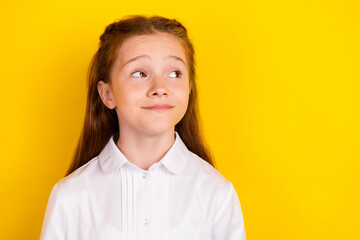 Poster - Photo of happy positive calm peaceful schoolgirl look copyspace thinking isolated on yellow color background