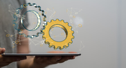 Poster - Cyborg hand holding a gear wheel interface 3d rendering.