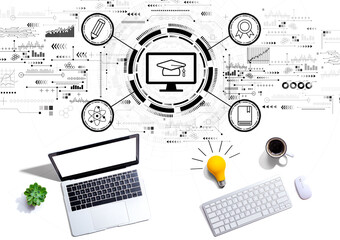 E-learning concept with computers with a light bulb