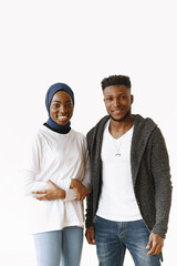 Young african couple standing on white background