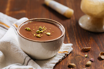 Chocolate pudding with pistachio crumbs on top