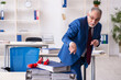 © Elnur - Old male employee with dynamite in the office