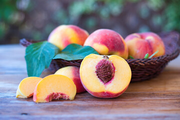 Wall Mural - Peaches with leaves on the old wooden table