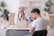 © Elnur - Young male asthamatic visiting old male doctor