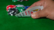 Casino games concept,Stacks of poker chipson gamble table including red, black, white, green and blue on a white background.