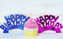 Pink And Blue Happy Birthday Paper Text And Pink Muffin 