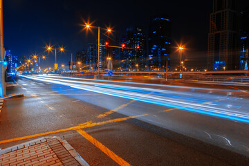 Long exposure of moving cars on night road in Dubai