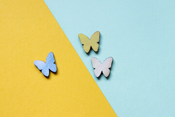 Canvas Print - Beautiful colorful butterflies on a yellow and light blue background - great for wallpaper