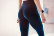 © WellStock - Close up view of sexual sporty tempting beautiful attractive nice round ass wearing tight leggings