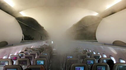 Canvas Print - Spray sanitizer injected inside a commercial aircraft. Disinfectant water drops in covide pandemic