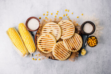 Wall Mural -  Top view of arepas made with corn flour, Latin American food concept