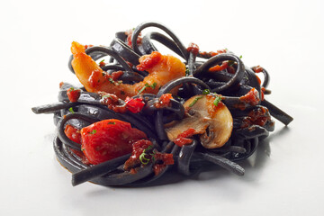 Sticker - Closeup heap of black spaghetti with shrimps and fried vegetables served on white background