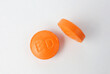 © เพิ่มศักดิ์ สุวรรณ์ - Orange medicine pills on white background. Vitamins.