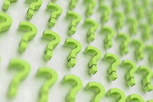 Three-dimensional Rendered Green Question Marks On A White Background. 3D Rendering.