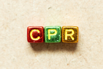 Poster - Metallic color alphabet letter block in word CPR (abbreviation of Cardiopulmonary resuscitation) on wood background