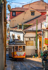 Wall Mural - Famous vintage tram in the street of Alfama, Lisbon, Portugal