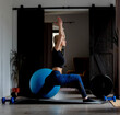 young woman doing sports exercises at home