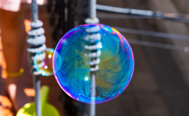 Poster - Soap bubbles flying into the sky from a balcony