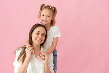 Wall Mural - close up photo of a beautiful young mother hugging her little daughter. best friends hugs, sincere h
