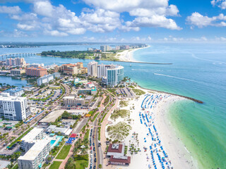 Wall Mural - Panorama of city Clearwater Beach FL. Summer vacations in Florida. Beautiful View on Hotels and Resorts on Island. Blue-Turquoise of Ocean water. American Coast or shore Gulf of Mexico. Sunny day.