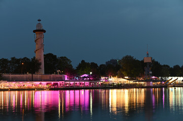 Canvas Print - lighthouse on Danube island by night in Vienna Austria