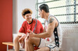 © zinkevych - Two basketball players sitting in a changing room and talking