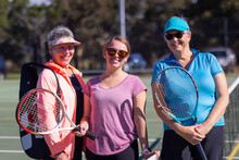 Three Women Ready To Play Casual Tennis