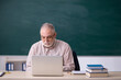 © Elnur - Old male teacher in front of blackboard