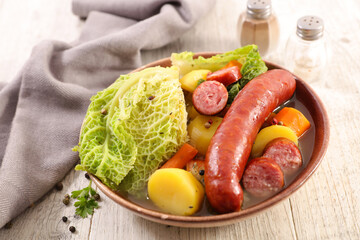 Canvas Print - vegetable,  sausage and broth with herbs