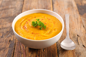 Wall Mural - vegetable soup in bowl with parsley