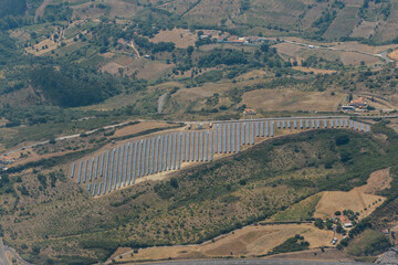 Canvas Print - Aerial view of solar panels in a rural area