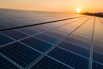 blue photovoltaic solar panels mounted on building roof for producing clean ecological electricity a