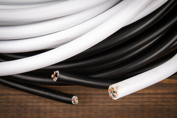 White and black electric cables. For interior installation and exterior work