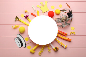 Wall Mural - Flat lay composition with carnival items and blank card on pink wooden background. Space for text