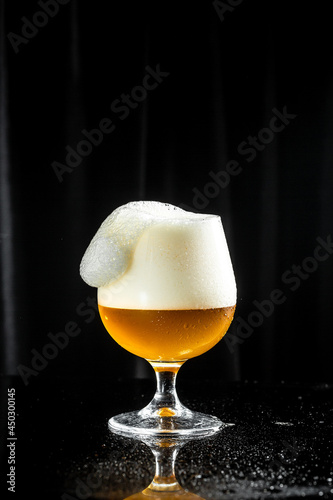 glass of beer, splash, Freeze motion splash drops of beer foam black background