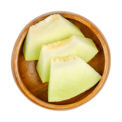 Wall Mural - Galia melon slices, in a wooden bowl. Triangular and ready-to-eat pieces of a freshly cut and ripe fruit of Cucumis melo var. reticulatus, a sweet and aromatic hybrid melon, also known as sarda. Photo