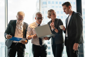 Wall Mural - Group of business People Meeting  in office on window . marketing team Conference Brainstorming. manager man standing and present . Financial Teamwork discussing strategy at workspace on cityscape