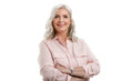 © gzorgz - Studio portrait of grey haired senior woman looking at camera and smiling while standing at isolated white background. Copy space.