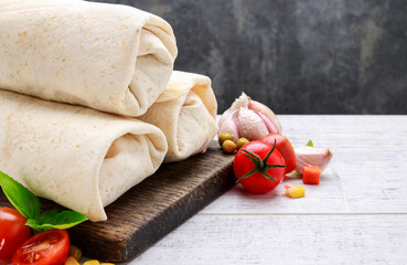 Canvas Print - A burrito - mexican dish that consists of a flour tortilla with various ingredients.