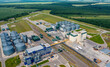 © Vadim - Modern granary elevator. Silver silos on agro-processing and manufacturing plant. Agricultural products, flour, cereals and grain. Aerial view panorama