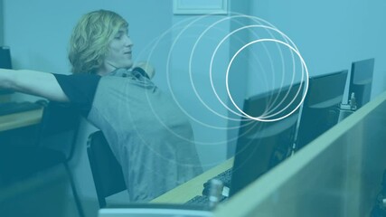 Poster - Animation of circles moving over male student using computer
