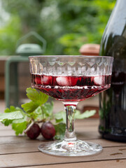 Wall Mural - Still life, glass goblet, ice and gooseberry. Concept of autumn mood, autumn is coming soon